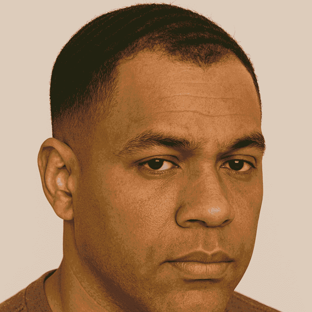 Black man with 360 waves and a low taper fade that blends the hairline cleanly Black man with 360 waves and a low taper fade that blends the hairline cleanly