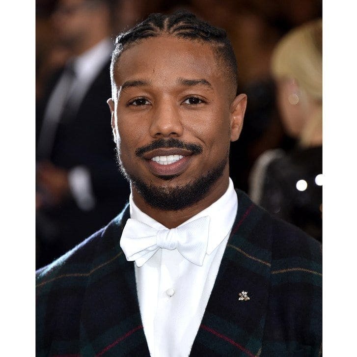 Formal Braided Hairstyle Michael B. Jordan wearing neatly braided cornrows with a tuxedo and bow tie at a formal event