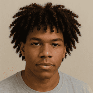 4C curls hairstyle example Young Black man with short 4C curls wearing a grey t-shirt