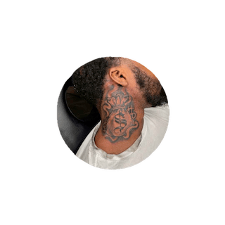 Money power neck tattoo design on Black man’s neck