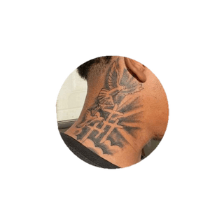 Religious and spiritual neck tattoo design on Black man’s neck”