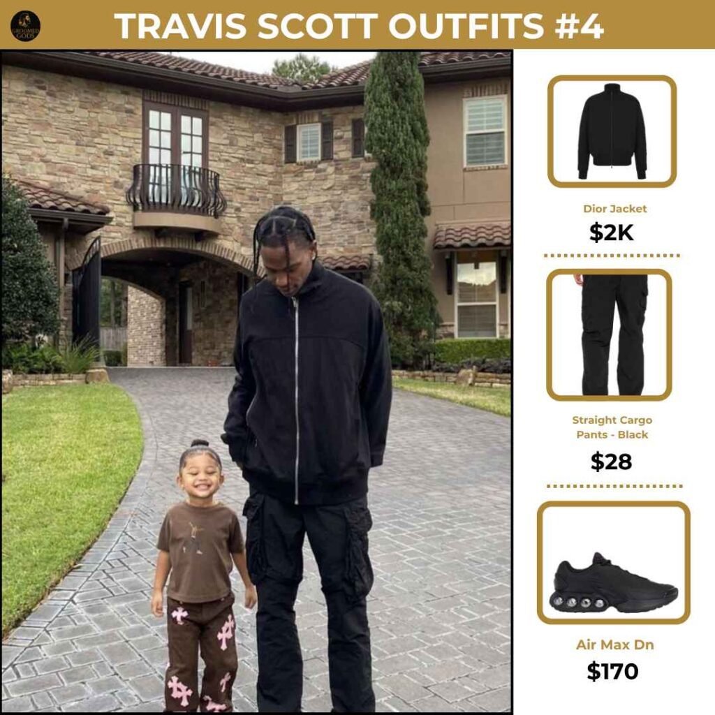 Travis Scott Outfit Breakdown #4 Travis Scott wearing a Dior jacket, black cargo pants, and Nike Air Max Dn sneakers while out with his daughter, showing his casual luxury streetwear style.