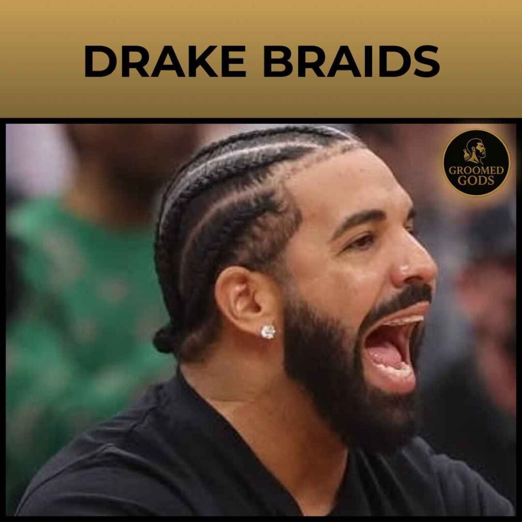 Side view of Drake with simple straight back cornrows and a low taper fade, hair braided neatly toward the back into a bun.